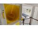 View of a game room with a pool table and yellow tube slide from the second floor at 7409 Chesley Ln, Durham, NC 27713