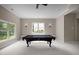 Finished game room features recessed lighting, sconces, and natural light from windows at 7409 Chesley Ln, Durham, NC 27713