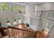 View of open-concept living room with fireplace and staircase at 7409 Chesley Ln, Durham, NC 27713