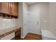 Inviting office area with custom desk, ample cabinetry, and a convenient entryway at 7409 Chesley Ln, Durham, NC 27713