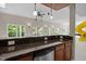 Open recreation area with bar, mini refrigerator, and large windows for natural light at 7409 Chesley Ln, Durham, NC 27713