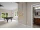 Recreation room with a pool table, window seating and access to a full bath at 7409 Chesley Ln, Durham, NC 27713