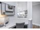 Cozy office space with a view of the kitchen, featuring stylish decor and a functional desk area at 747 Bachelor Gulch Way, Apex, NC 27523