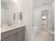 Bright bathroom features modern fixtures, a shower and tub combo, neutral colors, and natural light at 750 Bachelor Gulch Way, Apex, NC 27523