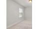 Bright and airy bedroom featuring carpet floor, white walls, and a window with an abundance of natural light at 750 Bachelor Gulch Way, Apex, NC 27523