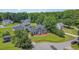 Aerial shot of a traditional two-story home with large lawn and lots of beautiful trees surrounding the house at 104 Goldleaf Ct, Angier, NC 27501