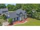 Bird's eye view of this stylish home with a manicured lawn, mature trees, and classic architecture at 104 Goldleaf Ct, Angier, NC 27501