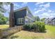 The house features a beautiful back exterior with a fenced yard and well-maintained landscaping at 104 Goldleaf Ct, Angier, NC 27501
