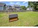 Spacious backyard featuring a wood fence, large lawn, and play area at 104 Goldleaf Ct, Angier, NC 27501