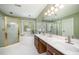 Bathroom featuring a jacuzzi tub, walk-in shower, and double sinks at 104 Goldleaf Ct, Angier, NC 27501