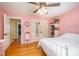 Bright bedroom showcasing hardwood floors and a white metal bed frame at 104 Goldleaf Ct, Angier, NC 27501