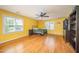 Spacious bedroom with hardwood floors, great natural light, and a ceiling fan at 104 Goldleaf Ct, Angier, NC 27501