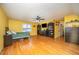 Large bedroom featuring a television, hardwood floors, and a ceiling fan at 104 Goldleaf Ct, Angier, NC 27501