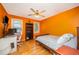Bright bedroom featuring hardwood floors, a ceiling fan, and large windows at 104 Goldleaf Ct, Angier, NC 27501