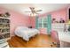 Charming bedroom featuring hardwood floors and a pink color scheme at 104 Goldleaf Ct, Angier, NC 27501