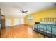 Large bedroom with hardwood floors and natural light from two windows at 104 Goldleaf Ct, Angier, NC 27501
