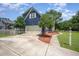 Exterior view of a two-story home with a driveway and two trees at 104 Goldleaf Ct, Angier, NC 27501