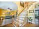 Traditional foyer features beautiful hardwood floors, stairs, and bright natural light at 104 Goldleaf Ct, Angier, NC 27501