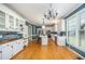 Large kitchen features white cabinets, stainless appliances, and a center island at 104 Goldleaf Ct, Angier, NC 27501