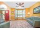 Bright living room with bay window, hardwood floors, and red front door entrance at 104 Goldleaf Ct, Angier, NC 27501