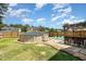 Backyard features an above-ground pool, lounging area, and outdoor bar for entertainment at 105 Rolling Stone Ct, Sanford, NC 27332