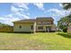 Large, grassy backyard featuring a charming pergola and privacy fence at 105 Rolling Stone Ct, Sanford, NC 27332
