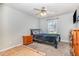 This bedroom features carpet flooring, ceiling fan, TV and natural light at 105 Rolling Stone Ct, Sanford, NC 27332