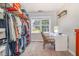 Spacious closet with organized shelving and a vanity with natural light at 105 Rolling Stone Ct, Sanford, NC 27332