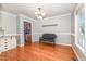 Dining room with hardwood floors and trim, chandelier, with a view of the kitchen at 105 Rolling Stone Ct, Sanford, NC 27332