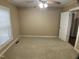 Comfortable bedroom features carpet, neutral walls, a window, and a ceiling fan at 108 Herbert St, Durham, NC 27703