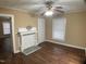 Cozy living room showcases a decorative fireplace, ceiling fan, and wood-look flooring at 108 Herbert St, Durham, NC 27703