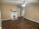 Spacious living room showcases wood floors, a fireplace, and a ceiling fan at 108 Herbert St, Durham, NC 27703