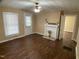 Light-filled living room featuring wood floors, a fireplace, and a bright window at 108 Herbert St, Durham, NC 27703