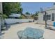 A patio with a table and chairs, as well as a basketball hoop, is ready for recreation at 1110 Edgewood Ave, Burlington, NC 27215