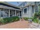 Cozy backyard patio with brick surface and access to the sunroom, perfect for outdoor relaxation at 1110 Edgewood Ave, Burlington, NC 27215