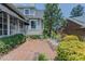 Charming backyard with brick patio, lush landscaping, and outdoor seating for entertaining at 1110 Edgewood Ave, Burlington, NC 27215