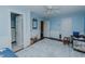 Cozy bedroom with blue walls, wainscoting, and a neutral patterned rug at 1110 Edgewood Ave, Burlington, NC 27215