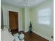Calm bedroom features light green walls, hardwood floors, a window, and easy access to a closet at 1110 Edgewood Ave, Burlington, NC 27215