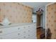 Bedroom featuring a vintage chest of drawers and antique decorations at 1110 Edgewood Ave, Burlington, NC 27215