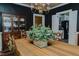 Formal dining room with table set, dark walls, and view of kitchen at 1110 Edgewood Ave, Burlington, NC 27215
