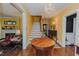 Grand foyer with hardwood floors, staircase, and elegant lighting at 1110 Edgewood Ave, Burlington, NC 27215