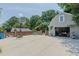 Detached garage with a basketball hoop and patio, ready for recreation at 1110 Edgewood Ave, Burlington, NC 27215