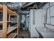 Functional basement laundry room with washer, dryer, and utility sink at 1110 Edgewood Ave, Burlington, NC 27215
