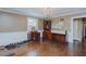Spacious living room features hardwood floors, an elegant chandelier and a built-in desk with shelves at 1110 Edgewood Ave, Burlington, NC 27215