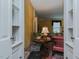 View of living room featuring hardwood floors, rug, table and sitting chair at 1110 Edgewood Ave, Burlington, NC 27215