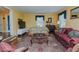 Bright living room with hardwood floors, comfortable sofas, and a piano at 1110 Edgewood Ave, Burlington, NC 27215