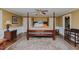 Bedroom showcasing a four poster bed, dresser and ceiling fan at 1110 Edgewood Ave, Burlington, NC 27215