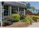 Charming patio area with lush greenery and space for seating at 1110 Edgewood Ave, Burlington, NC 27215