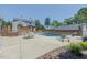 Beautiful backyard pool area with surrounding patio, and lush landscaping for ultimate relaxation at 1110 Edgewood Ave, Burlington, NC 27215
