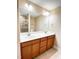 Bathroom featuring double sinks and a large mirror, perfect for a modern lifestyle at 115 Ballyliffen Ln, Cary, NC 27519